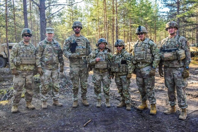 Recently promoted Lt. Gen. David M. Hodne, former commanding general of 4th Infantry Division, poses with distribution platoon and Havoc Forward Support Company leadership at Niinisalo Training Area, Finland, May 5, 2023. Two distribution platoon Soldiers were recognized for their integral part in the transportation of ammunition in support of Operation Arrow over 4,000 miles from Poland to Finland.