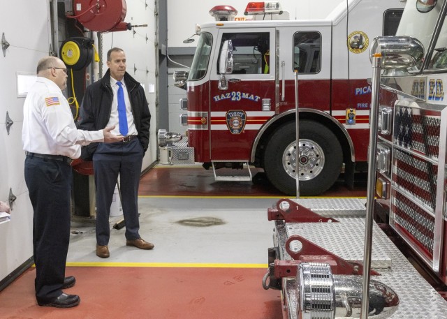 PICATINNY ARSENAL, N.J. - Christopher Foster, Fire Chief, Picatinny Arsenal Fire and Emergency Services, (left) briefs Installation Services Director Michael E. Reheuser, Office of the Deputy Chief of Staff G-9, (right) about the...