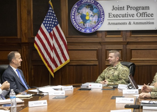 PICATINNY ARSENAL, N.J. - Installation Services Director Michael E. Reheuser, Office of the Deputy Chief of Staff G-9, (left) speaks with Maj. Gen. John T. Reim, Picatinny Arsenal’s commanding general and Joint Program Executive Officer...