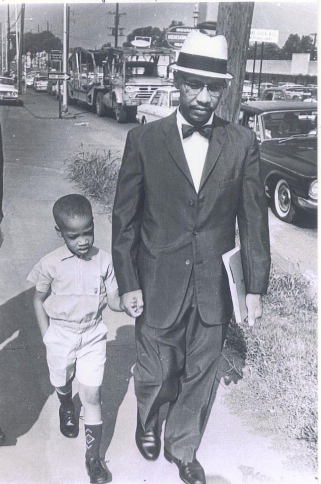 Sonnie, 6, walks with his father, Dr. Sonnie Hereford III, back home on Sept. 3, 1963, after they were turned away from the Fifth Avenue School in Huntsville. 