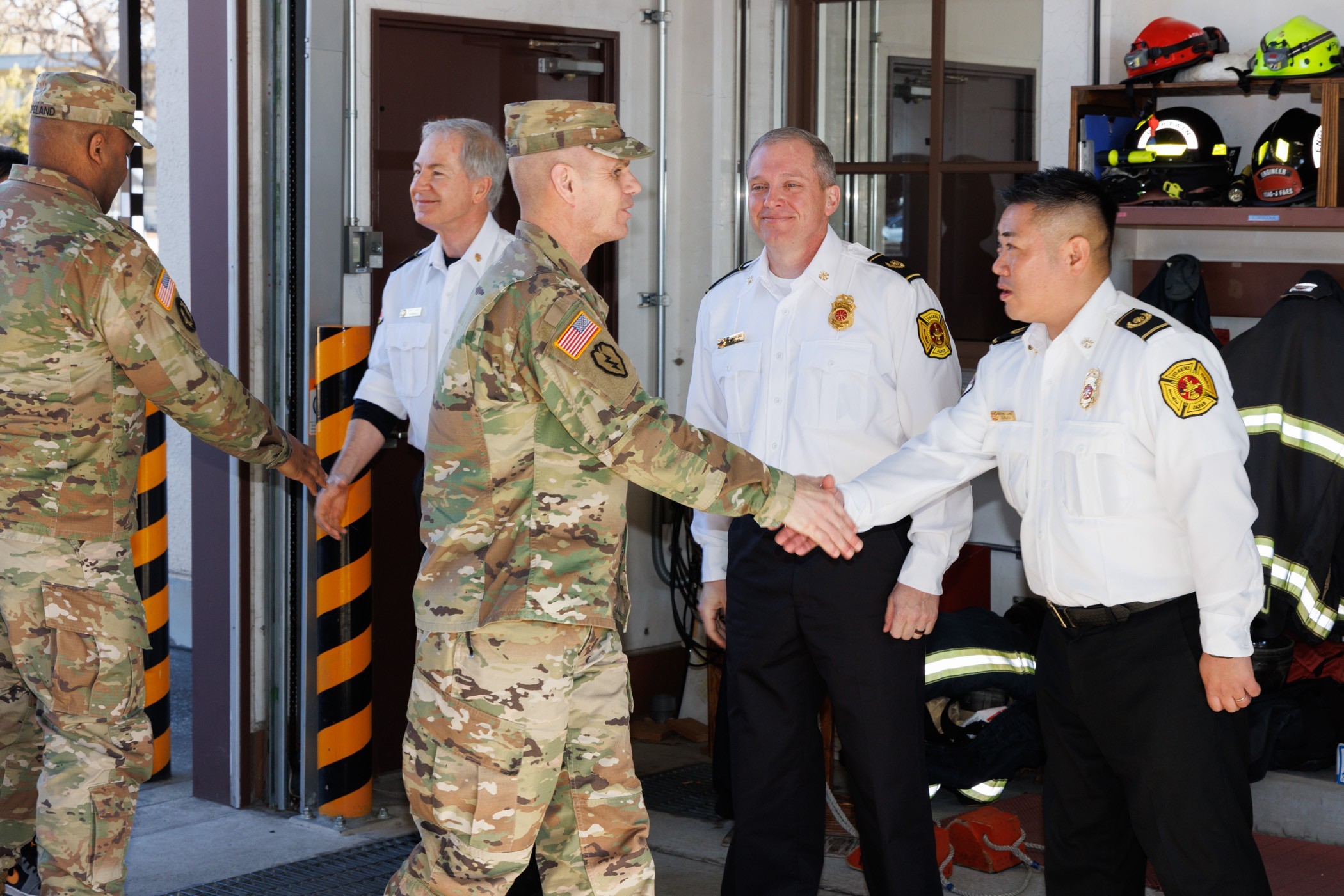 IMCOM command team touts garrison efforts during visit to Camp 