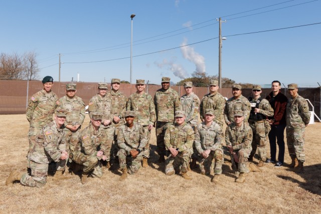 Members of the 901st and 88th Military Police Detachments at Camp Zama, Japan, gather for a photo with Lt. Gen. Omar Jones, commander of U.S. Army Installation Management Command, and Command Sgt. Maj. Jason Copeland, IMCOM senior enlisted leader, on Jan. 29, 2024, during a two-day trip to U.S. Army Garrison Japan. Jones and Copeland, accompanied by Brenda Lee McCullough, director of IMCOM-Pacific, made the visit to show gratitude to the workforce.