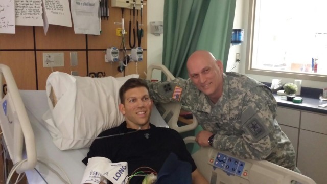 Gen. Raymond T. Odierno, 38th Chief of Staff of the Army, visits Maj. Patrick Miller at the hospital one week after the shooting. 