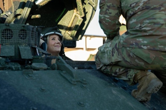 Honorable Christine Wormuth, United States secretary of the Army, climbs into the new M2A4 Bradley infantry fighting vehicle Tuesday at Fort Cavazos.