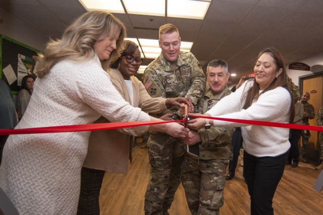 At a Jan. 30 event in Bldg. 470 to open Fort Leonard Wood’s new Spouse Resource Center, the ceremonial ribbon is cut by (from left) military spouse and volunteer Sally Beck; Eyonda Williams, with the Directorate of Human Resources; Maj. Gen....