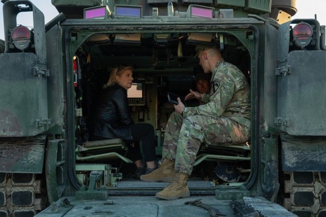 Honorable Christine Wormuth, secretary of the Army, speaks with Lt. Col. Rob Parsons, 1st Battalion, 5th Cavalry Regiment, commander, about the M2A4 Bradley infantry fighting vehicle Tuesday at Fort Cavazos.