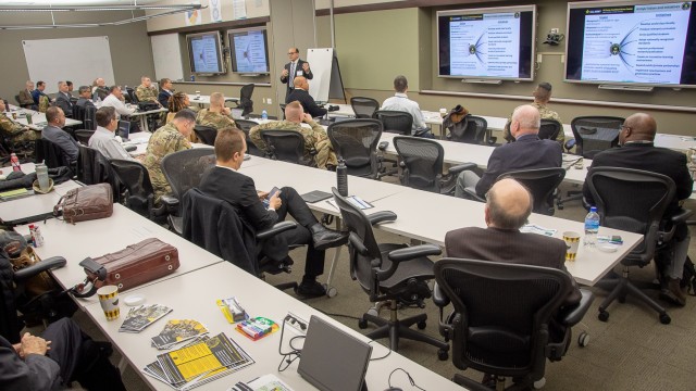 Dr. Keith Beurskens, Director, Vice Provost of Academic Affairs, stand at the front of a classroom during the 2024 Directors of Training Conference at the Lewis and Clark Center on Fort Leavenworth.