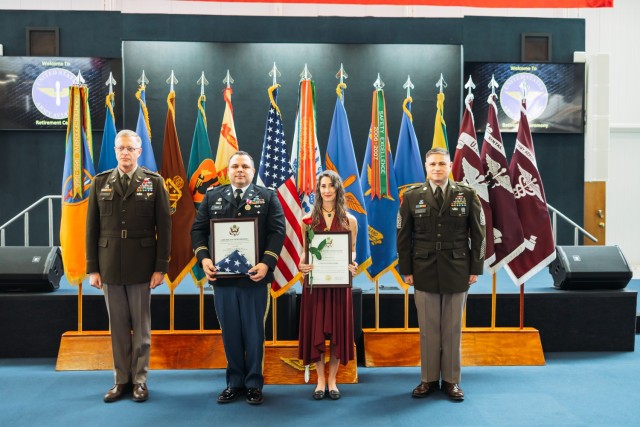 Capt. Marc J. Taylor stands with his spouse Tabitha Taylor at Fort Novosel retirement ceremony at the Army Aviation Museum on Feb. 2, 2024.
