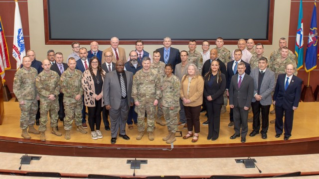 Attendees of 2024 Directors of Training Conference pose on the stage of the Marshall Conference Room in the Lewis and Clark Center on Fort Leavenworth, Kan.