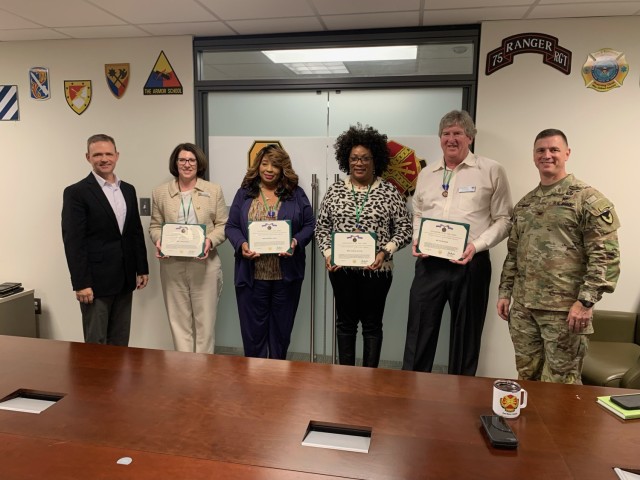 FORT MOORE, Ga – Fort Moore garrison leadership recognize civilian employees participating in the first quarter developmental assignment program Jan. 16, 2024, at McGinnis-Wickam Hall. From left to right, Brandon Cockrell, deputy garrison...