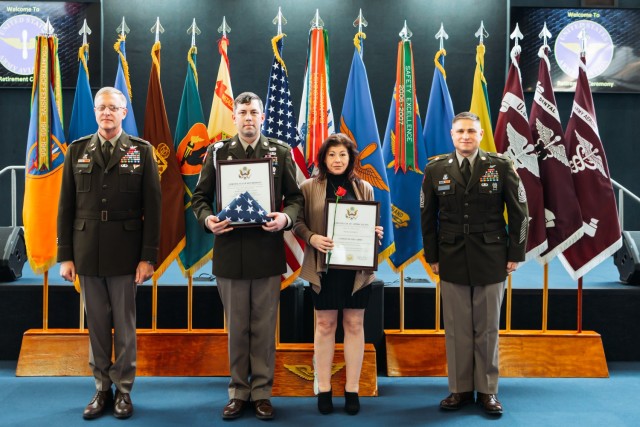 Sgt. 1st Class Erich G. Schmitt stands with his spouse Nicole Schmitt at the Fort Novosel retirement ceremony at the Army Aviation Museum on Feb. 2, 2024.
