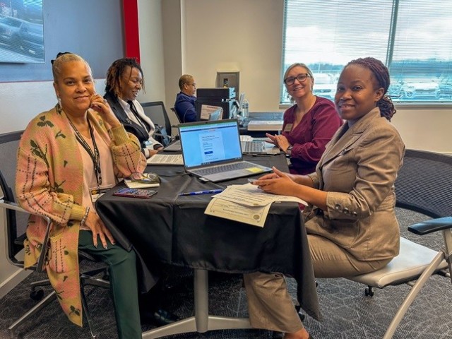Seated at a table in the human resources area, clockwise from left, are Michelle Watkins, Julia Wilson, Sherry Major and job applicant Eranika Ford during the Garrison’s public hiring event Jan. 31 at the Yulista building in Redstone Gateway. 