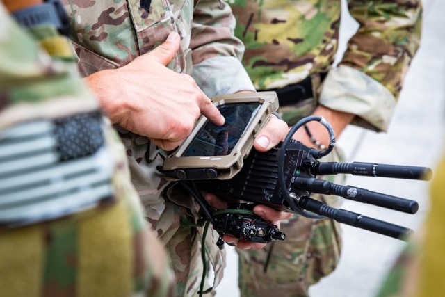 Soldiers from U.S. Army Special Operations Command train with devices connected via the Defense Advanced Research Projects Agency (DARPA) Secure Handhelds on Assured Resilient networks at the tactical Edge (SHARE) system in preparation for their employment during Project Convergence 22. PC22 is an All-Service and Multinational campaign of learning featuring experiments on hundreds of different technologies and capabilities.