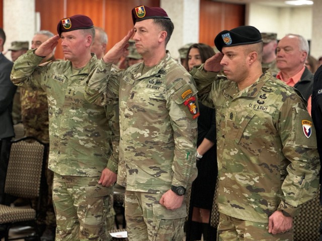 Command Sgt. Maj. Ricardo Moreno (right), Command Sgt. Maj. Reese Teakell (center) and Maj. Gen. Todd Wasmund (left) saluting during the National Anthem as part of Moreno’s assumption of responsibility ceremony.