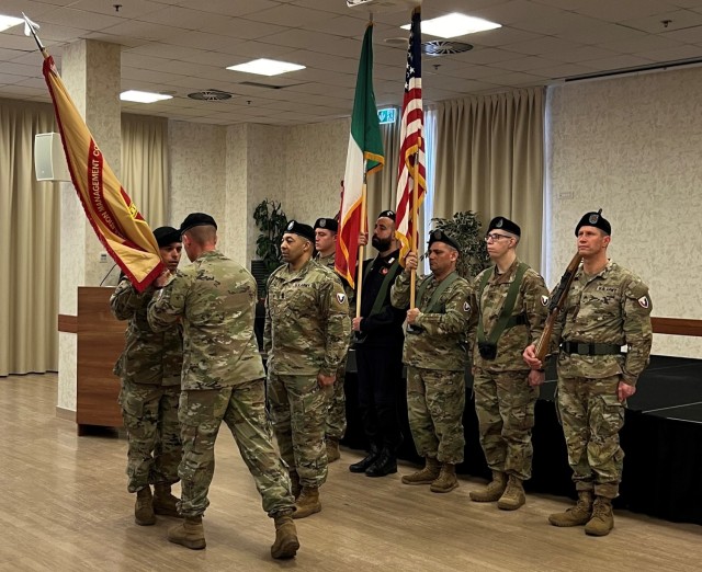 Col. Scott Horrigan, USAG Italy’s commander, passed the unit colors to Command Sgt. Maj. Ricardo Moreno,  during Moreno’s assumption of responsibility ceremony at Casema Ederle on Feb. 6, 2024.
