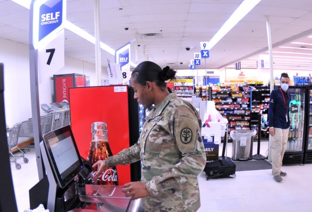 Spc. Daija Alexandre, Army Dental Command, uses the register at one of several self-check stations recently installed at the Fort Gregg-Adams main exchange in this 2023 file photo.