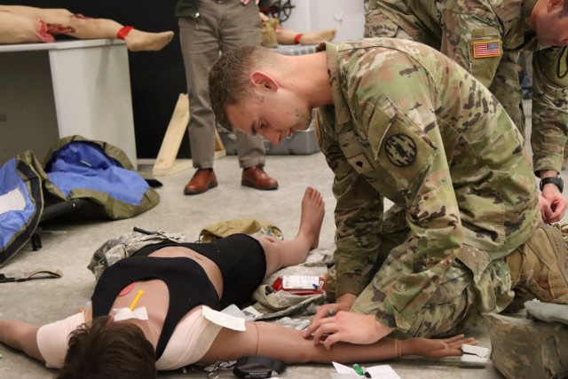 Spc. Andrew Amm, 89th Military Police Brigade, performs a simulated intravenous line insertion on the first female medical manikin developed for the U.S. Army. (U.S. Army photo by Shawn Davis, Fort Cavazos Public Affairs)