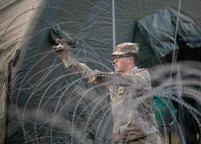A Soldier assigned to the 207th Military Intelligence Brigade-Theater participates in the immersive intelligence scenario-based exercise.