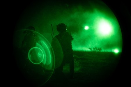 A Soldier assigned to 3rd Special Forces Group (Airborne) marks a landing zone for a CH-47 with an infrared laser after a nighttime raid on a village in support of Sage Eagle 24 on White Sands Missile Range, New Mexico, January 27, 2024. Sage...