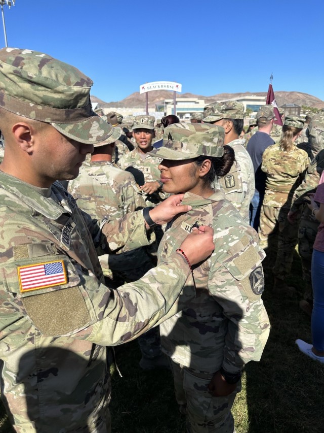 Two USARIEM Soldiers walk away with Expert Field Medical Badges. ‘Success requires sacrifice.’