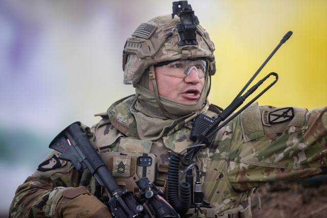 A Soldier from the 2nd Battalion, 22nd Infantry Regiment, 1st Brigade Combat Team, 10th Mountain Division, directs his squad during a combined-arms live-fire exercise Feb. 6, 2023, on Fort Drum, New York. Combined arms live-fire exercises provide...