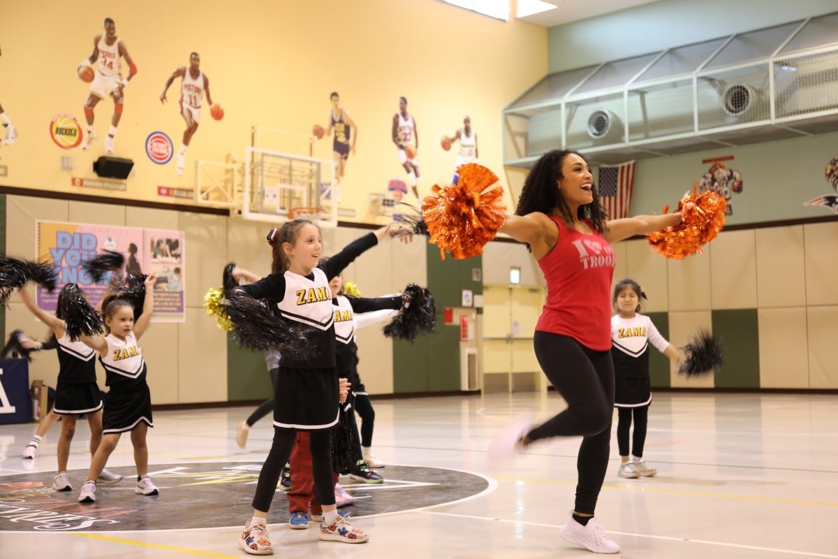 NFL cheerleaders teach universal language of 'dance' to military