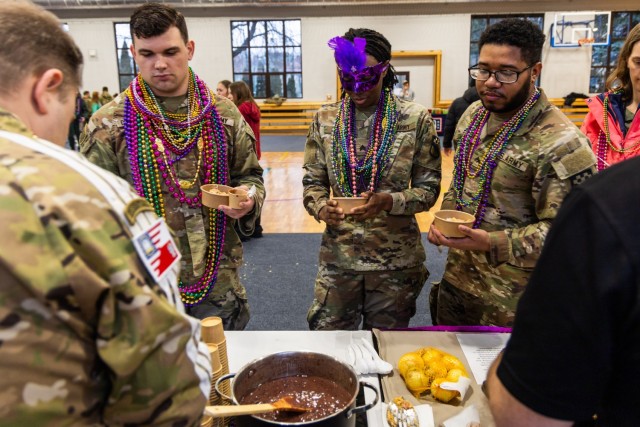 Soldiers taste Louisiana cooking at Camp Kosciuszko in Poznan, Poland, Feb. 9, 2024 during a Mardi Gras celebration. The event was hosted by the 773rd Military Police Battalion, a Louisiana Guard Unit based out of Pineville. The unit has spent the past year providing security and law enforcement capabilities to U.S. Army Garrison Poland.