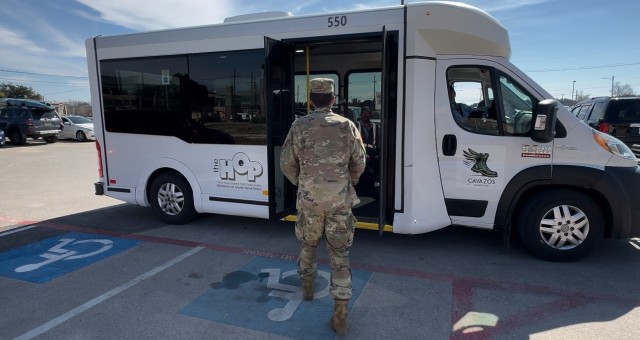 A Fort Cavazos Soldier boards the Cavazos Connector Feb. 5 at the Theodore Roosevelt Dining Facility for a ride back to the barracks. (U.S. Army photo by Darren Cinatl, Fort Cavazos Public Affairs)