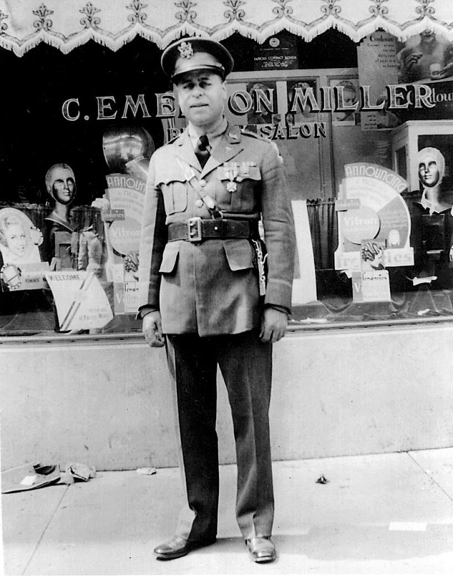 Army Maj. Frank Boston stands in his uniform outside of a store circa World War I. After the war, Boston, a doctor, started his own hospital and ambulance corps.