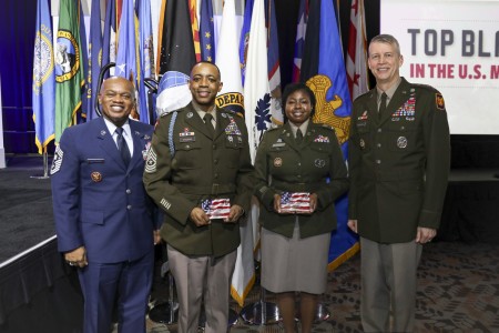 From left, Senior Enlisted Advisor Tony Whitehead, SEA to the chief, National Guard Bureau; Sgt. Maj. Alan Thomas, operations sergeant major, Indiana National Guard; Chief Warrant Officer 3 Regina Carrell, a senior strategic intelligence analyst at the National Guard Bureau, and Army Gen. Daniel Hokanson, chief, National Guard Bureau, at the Black Engineer of the Year Award Science, Technology, Engineering and Mathematics Stars and Stripes dinner and reception, Baltimore, Maryland, Feb. 16, 2024. The National Guard Bureau was the featured military organization of the 2024 Stars and Stripes event. (U.S. Army National Guard photo by Sgt. 1st Class Zach Sheely)