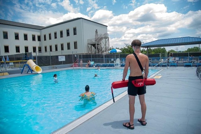 A lifeguard watches out for swimmers enjoying a day at Goss Road pool.