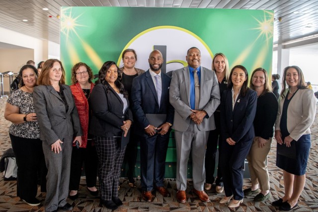 Dr. Eric Moore, U.S. Army Combat Capabilities Development Command, or DEVCOM, Deputy to the Commanding General, center right, poses for a group photo with DEVCOM Black Engineer of the Year Awards in Science, Technology, Engineering and Math winners and DEVCOM civilians Feb. 17, 2024, at the Baltimore Convention Center in Baltimore, Maryland. 