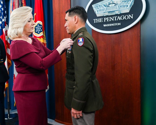 Secretary of the Army Christine Wormuth presents the Army Astronaut Device to Col. Frank Rubio during a pinning ceremony at the Pentagon Press Briefing Room, Feb. 22, 2024.