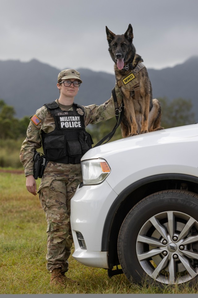 U.S. Army Sgt. Stacey Collins, a military working dog handler, poses with U.S. Army military working dog Hugo, both with the 8th Military Police Brigade, 8th Theater Sustainment Command, Feb. 07, 2024, Schofield Barracks, HI. (U.S. Army photo captured by Staff Sgt. Tristan Moore)