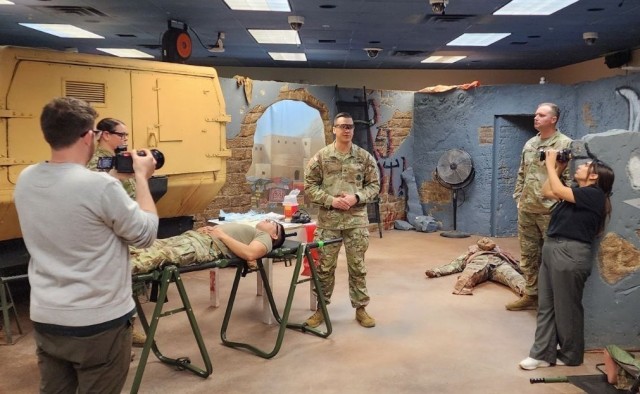 Staff Sgt. Jacob Whitlock, a combat medic instructor, demonstrates autologous whole blood Training for an Army recruiting video. 