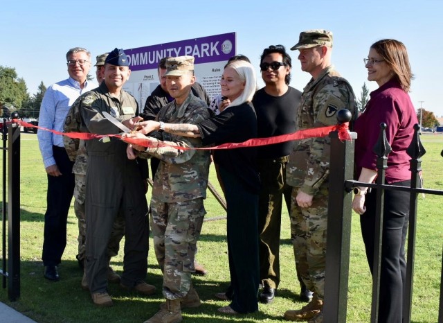 Col. Kent Park, center, Joint Base Lewis-McChord commander, cuts the ribbon to officially open the new community park on Lewis Main Sept. 21. He was joined by Col. Brandon Sokora, center left, JBLM deputy commander; Charles Markham, far left,...