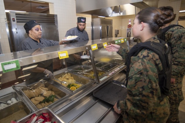 Tonica Todd (left) and Candido Calcano serve breakfast to service members Feb. 27 at the Army Warrior Restaurant in Bldg. 1784. In an effort to better align with the Army’s holistic health and fitness goals, nutrition experts have worked to...