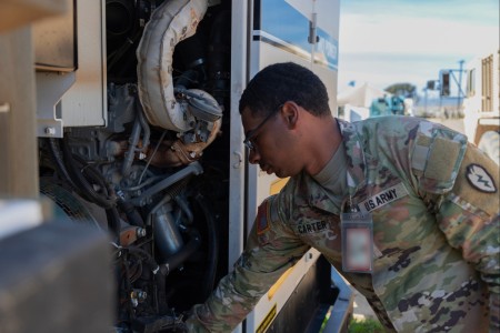 U.S. Army Spc. Cartia Carter, assigned to the 524th Division Sustainment Support Battalion, 25th Division Sustainment Brigade, readies a vehicle as he prepares for experimentation during Project Convergence - Capstone 4 at Camp...
