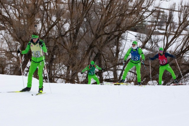 The Washington National Guard men&#39;s Patrol Team climbs an incline during the 50th anniversary Chief of the National Guard Bureau Biathlon Championships at Soldier Hollow Nordic Center Feb. 21, 2024. The Utah National Guard hosted the national...