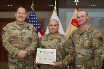 U.S. Army Garrison Yongsan-Casey personnel assigned to Area II are congratulated by the U.S. Army Garrison Yongsan-Casey command team during an employee...