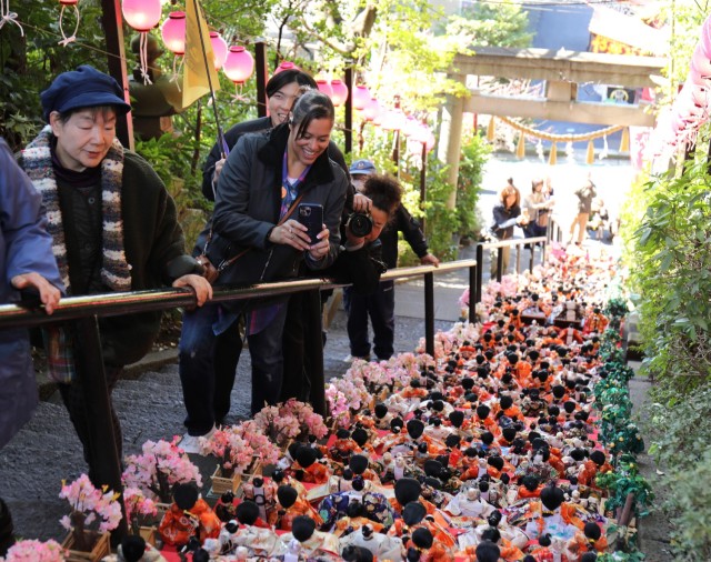 Visitors to Zama Shrine admire the rows of dolls on display for the Dolls Festival, or &#34;Hinamatsuri,&#34; in Zama, Japan, March 1, 2024. The Army Community Service at Camp Zama hosted a walking tour to the shrine for community members to enjoy...