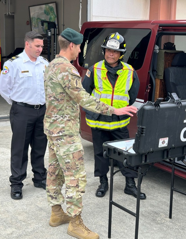 Col. Marcus Hunter, U.S. Army Garrison Japan commander, discusses fire and emergency service procedures with members of the garrison team during a recent two-day trip to the Kure Ammunition District in Hiroshima, Japan.