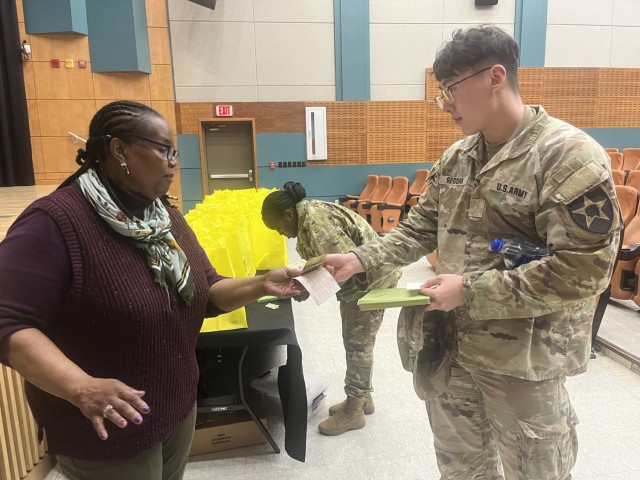 U.S. Army 2nd Lt. Jonathan Segura, 61st Support Maintenance Company, turns in a donation and pledge form to Barbara Brown, the U.S. Army Garrison Yongsan-Casey Army Emergency Relief (AER) officer, during AER unit representative training at Casey...