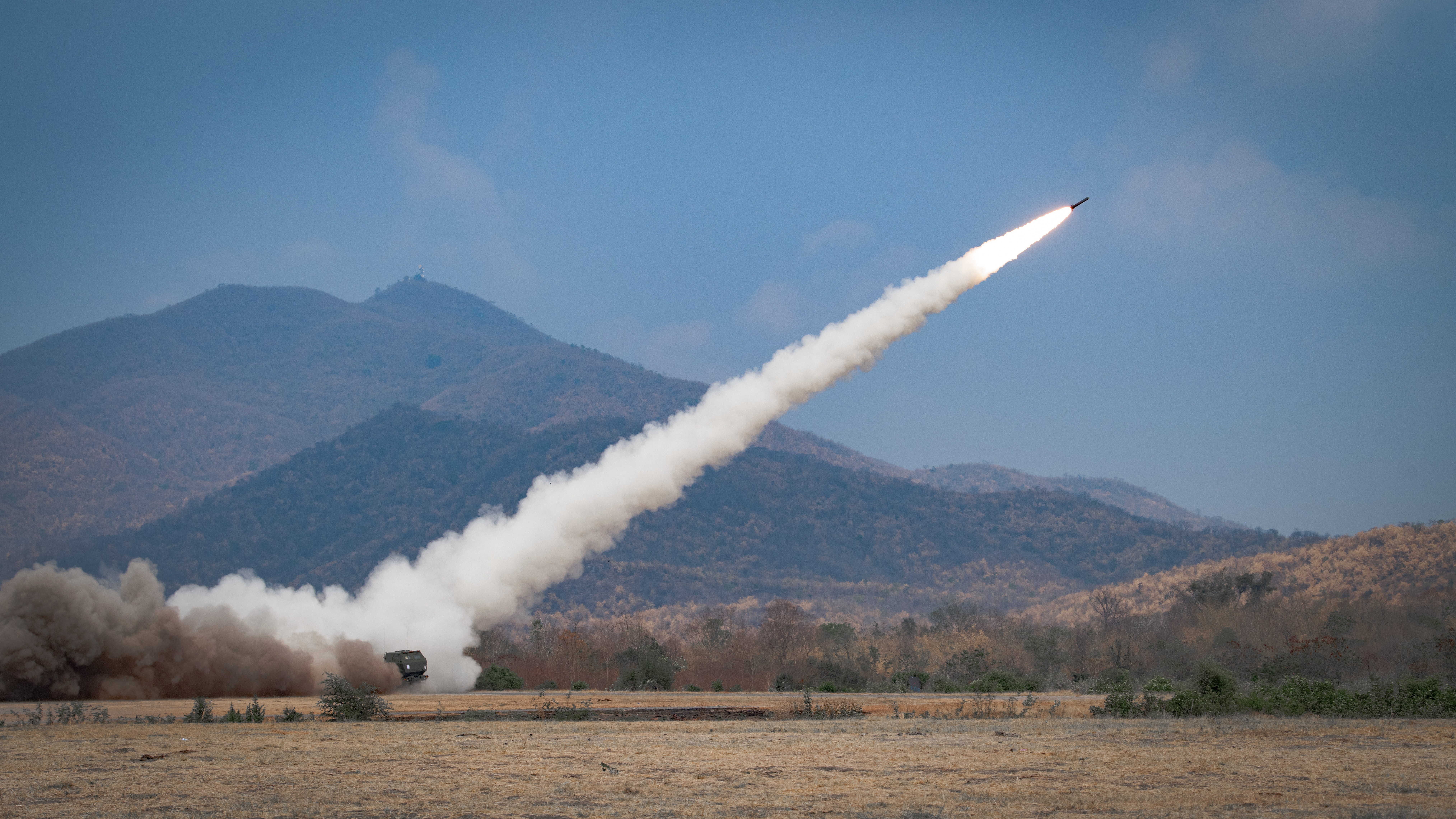 High Mobility Artillery Rocket Systems (HIMARS) with the 1-94th Field Artillery, 17th Field Artillery Brigade, fire missiles at simulated targets during exercise Cobra Gold 2024 on a range near Lop Buri, Thailand, March 4, 2024. HIMARS are a...