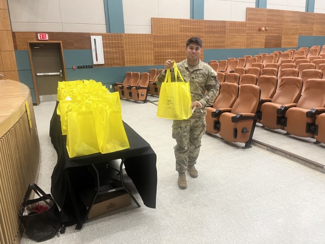 U.S. Army Capt. Mack Ocariza, 210th Field Artillery Brigade, carries a bag of Army Emergency Relief (AER) campaign materials during a unit representative training session held at Casey Theater, Feb. 21, 2024. AER has provided over $2 billion of...