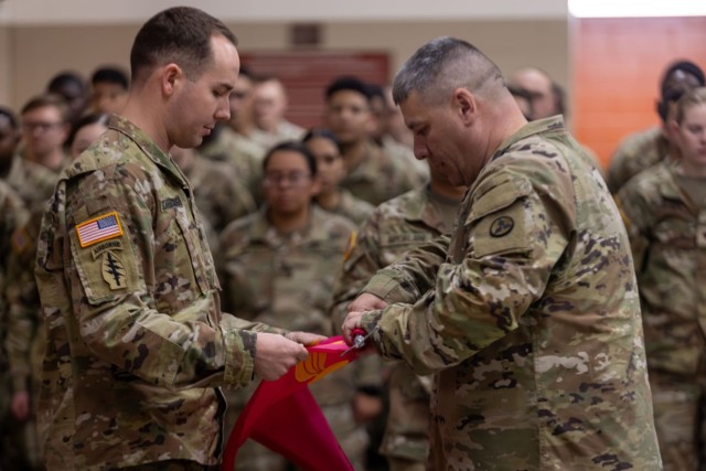 U.S. Army Capt. Robert Scarborough, commander of the 8th Ordnance Company, 264th Combat Sustainment Support Battalion, 3rd Expeditionary Sustainment Command, wraps the guidon during the casing ceremony on Fort Liberty, N.C., Feb. 27, 2024. The casing of the guidon signifies the unit’s preparation for their upcoming deployment in support of Operation European Assure, Deter and Reinforce. 