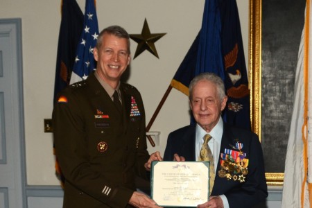 Gen. Daniel Hokanson, left, chief of the National Guard Bureau, presents retired Army Capt. Larry Liss with a Silver Star citation during a ceremony March 5, 2024, at Valley Forge Military Academy in Wayne, Pa. Liss received the medal, an upgrade from a Distinguished Flying Cross, for rescuing more than 80 U.S. and South Vietnamese soldiers during the Vietnam War.