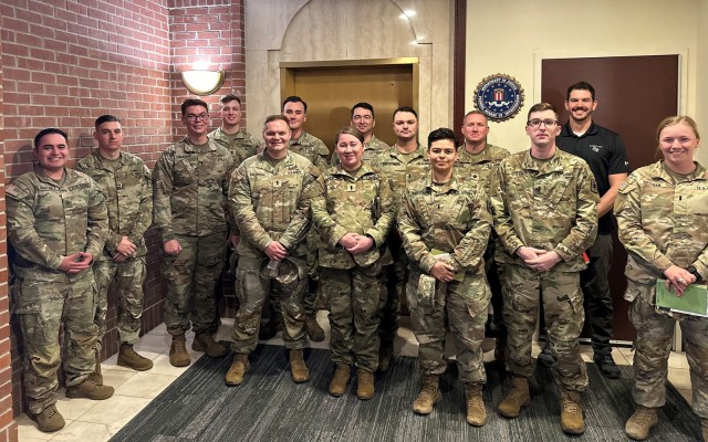 Soldiers from the 787th Military Police Battalion pose with FBI Special Agent Michael Effland on March 6 during a tour of the Springfield, Missouri, resident agency office. 