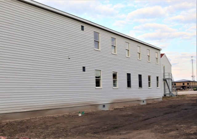 Reset of World War II-era barracks moved in 2023 continues; work nearly complete