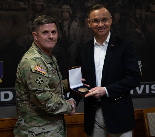 Polish President Andzrej Duda receives a gift from U.S. Army Brig. Gen. Jeremy Wilson, 3rd Infantry Division’s Deputy Commanding General of Maneuver at Fort Stewart, Georgia, March 13, 2024. Poland and the United States enjoy a deep and longstanding friendship and historical commitment to shared transatlantic values. The political, economic, security and cultural ties between our two countries are broad, deep, and growing stronger. (U.S. Army photo by Pfc. Rebeca Soria)